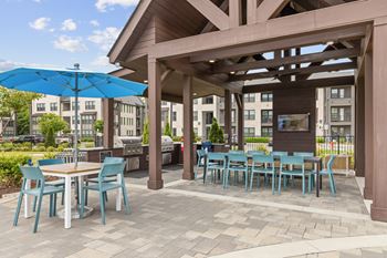 Summerhouse with grills, picnic tables, and tv